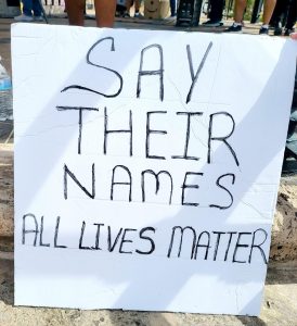 Poster Board reading "Say Their Names, All Lives Matter."
